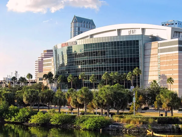 Amalie Arena in Tampa with palms and the downtown skyline